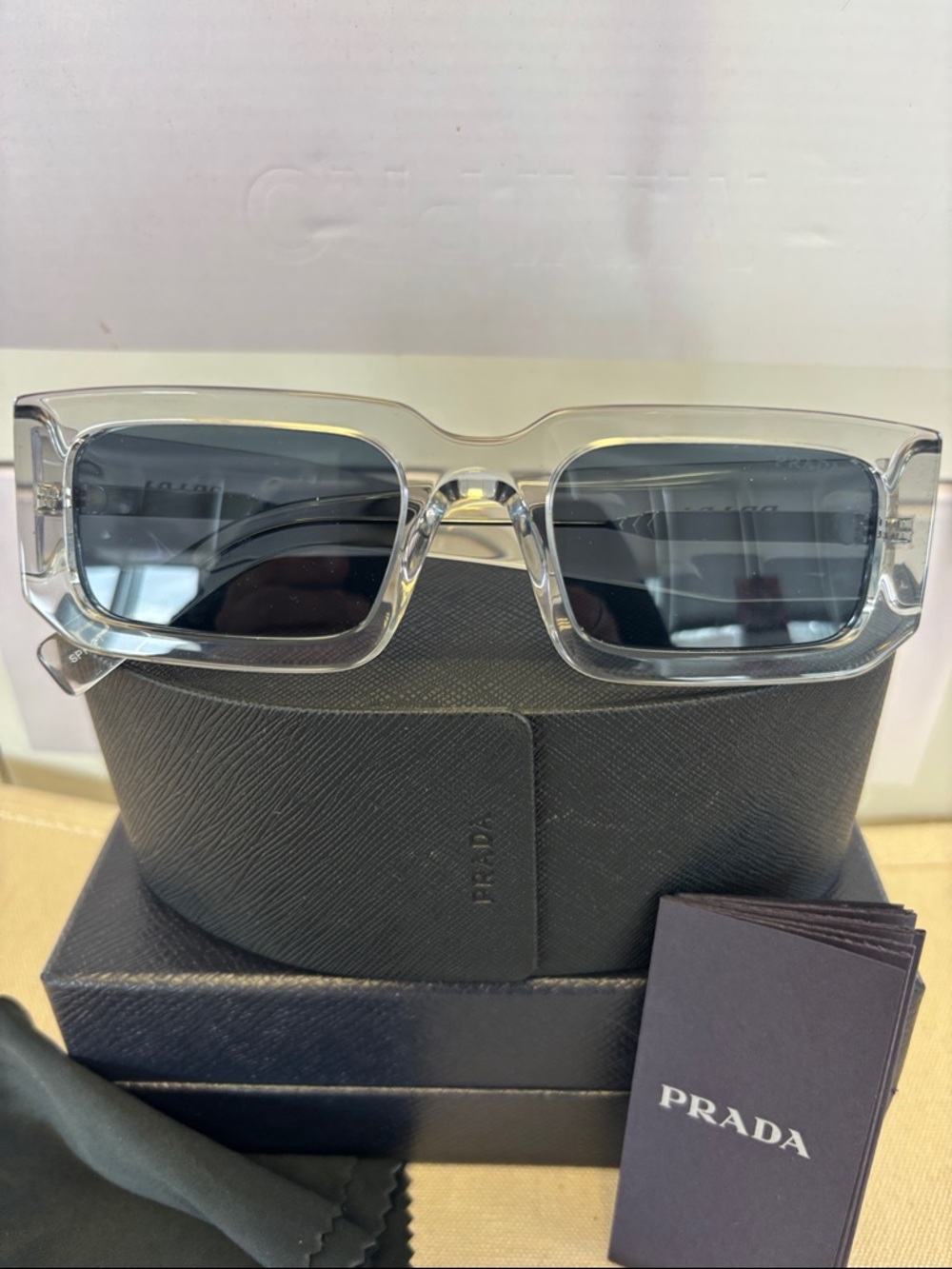 Prada Clear Frame Sunglasses with Dark Gray Lenses